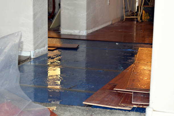 Professional Flood Damage Restoration technician working in Glendale, RI